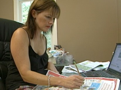 VIDEO: Coupon cutting and special savings can drastically cut the grocery bill.