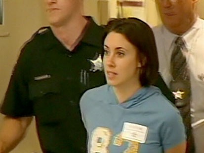 A picture of Casey Anthony in handcuffs.