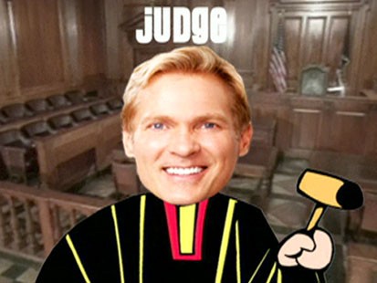 A picture of Sam Champions head on a cartoon judges body.