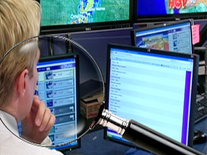 A picture of Sam Champion using the Self-Directed Search with a magnifying glass on top of the image.