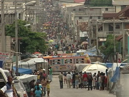 VIDEO: Citizens still live in tent cities, and orphans roam the streets.