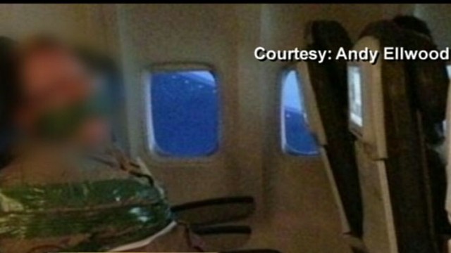 airline passenger duct taped to seat 2021