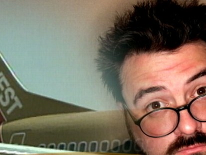 VIDEO: Director Kevin Smith claims he was kicked off a flight for being too fat.