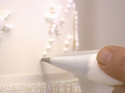 VIDEO: Nick Watt searches for clues to who will bake William and Kates wedding cake.