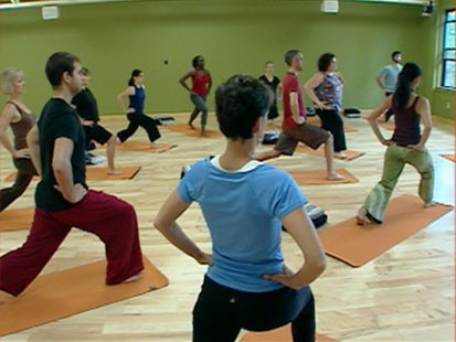 A picture of people doing yoga.