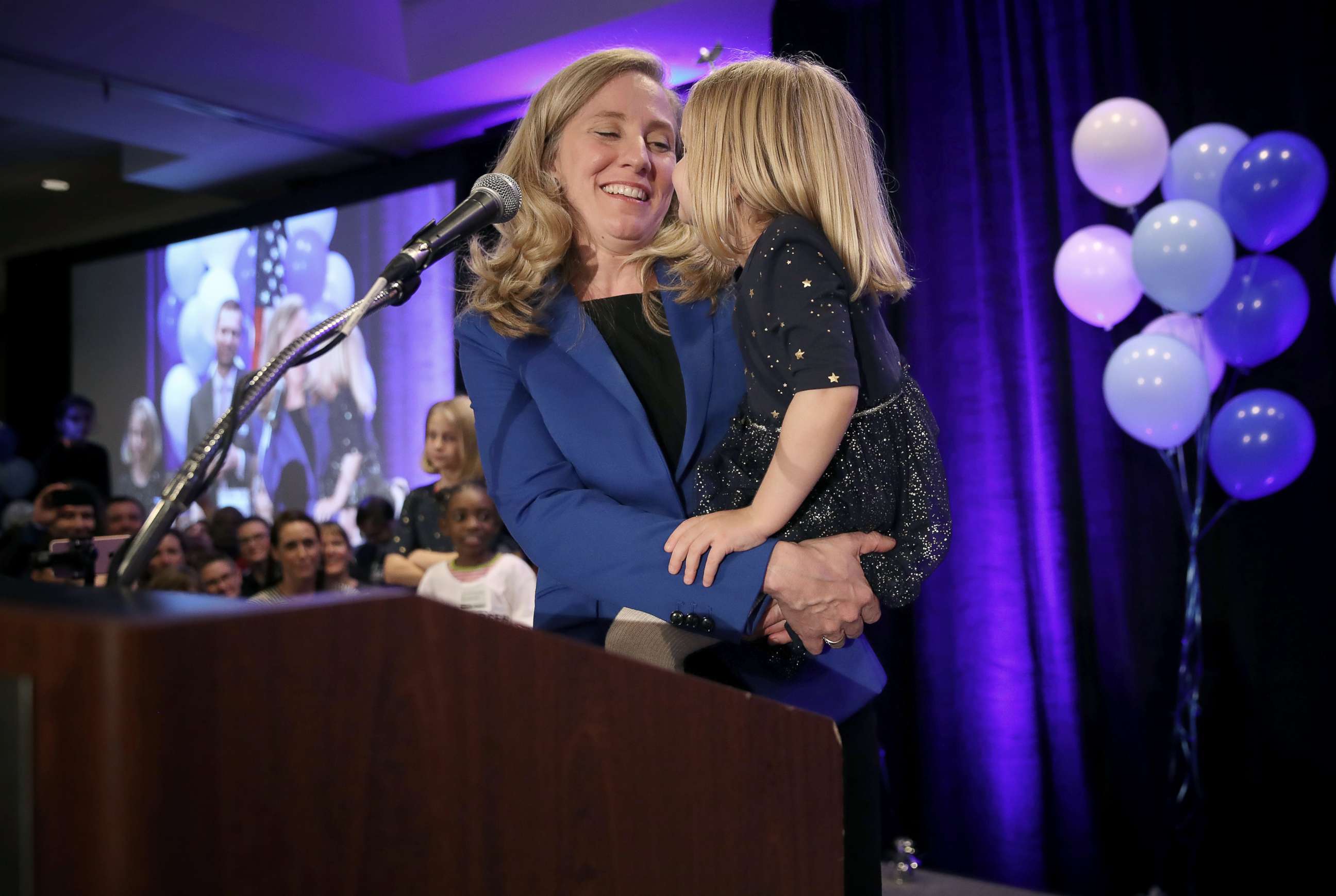PHOTO: Abigail Spanberger, democratic candidate for Virginia's Seventh District, holds her daughter Catherine as she thanks supporters at an election night rally, Nov. 6, 2018, in Richmond, Virginia.