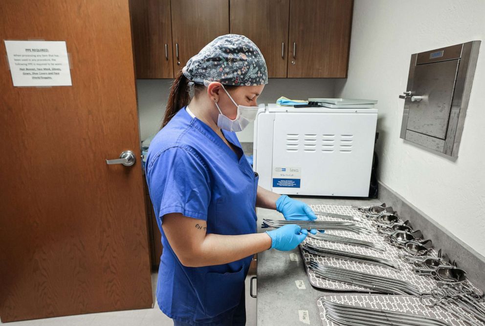 PHOTO: In this Dec. 6, 2021, a surgical tech organizes medical instruments at Trust Women clinic in Oklahoma City.