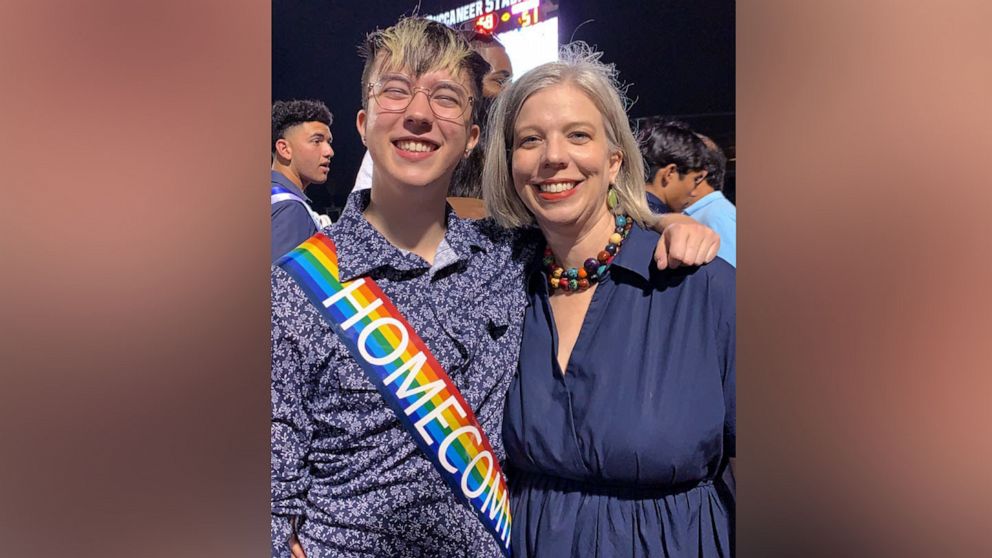PHOTO: Adair Apple, of Corpus Christi, Texas, poses with her son, Charlie, at his high school's homecoming game in October 2021.
