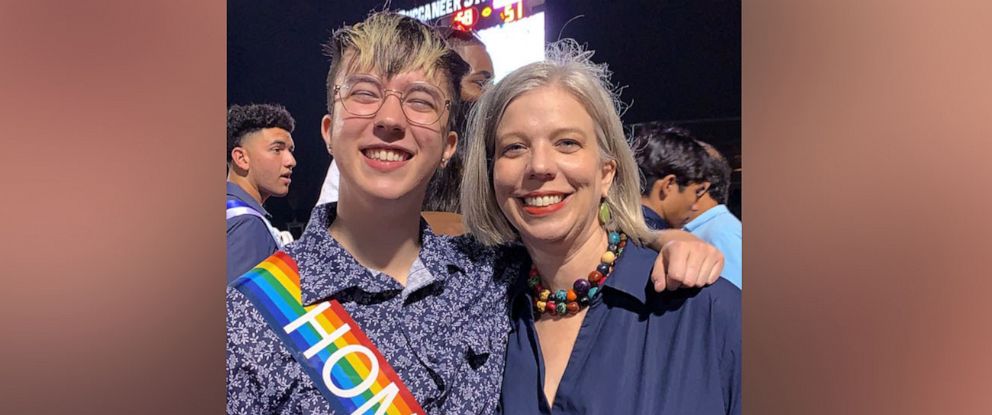 PHOTO: Adair Apple, of Corpus Christi, Texas, poses with her son, Charlie, at his high school's homecoming game in October 2021.