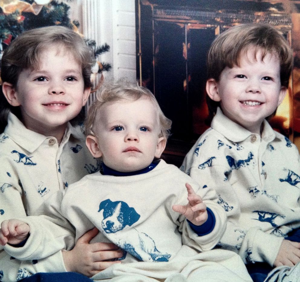 PHOTO: A young Adam Rippon smiles with his brothers for a holiday family photo.