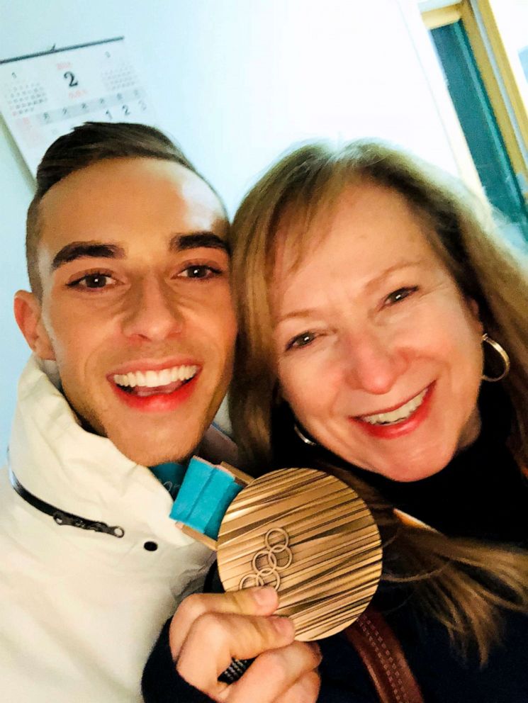 PHOTO: Adam Rippon and his mother, Kelly Rippon, pose with the bronze medal he won at the 2018 Winter Olympics in Pyeongchang, South Korea, in the figure skating team event.