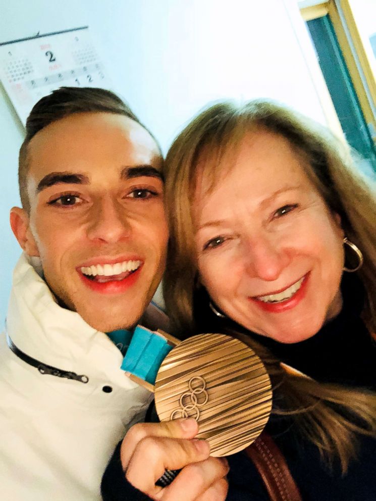 PHOTO: Adam Rippon and mom, Kelly, smile proudly as he displays his bronze medal from the 2018 Winter Olympics.