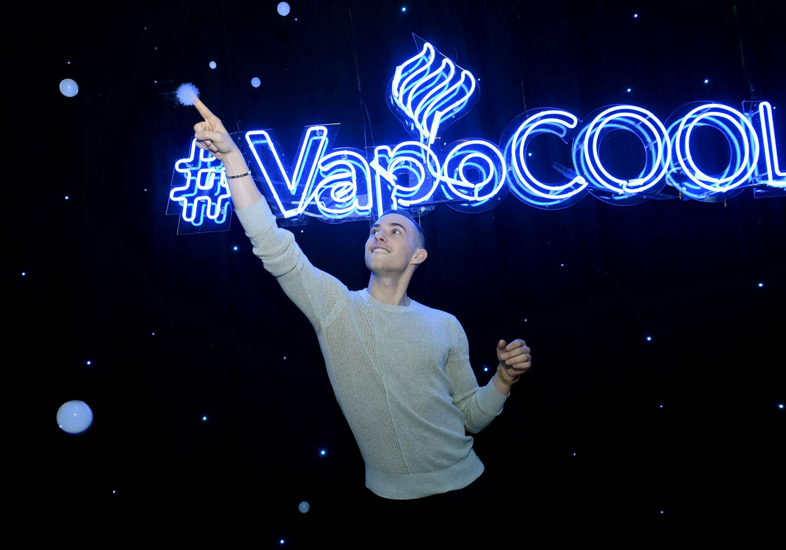 PHOTO: Adam Rippon poses at the NyQuil and DayQuil VapoCool experience in New York City on December 13, 2018.
