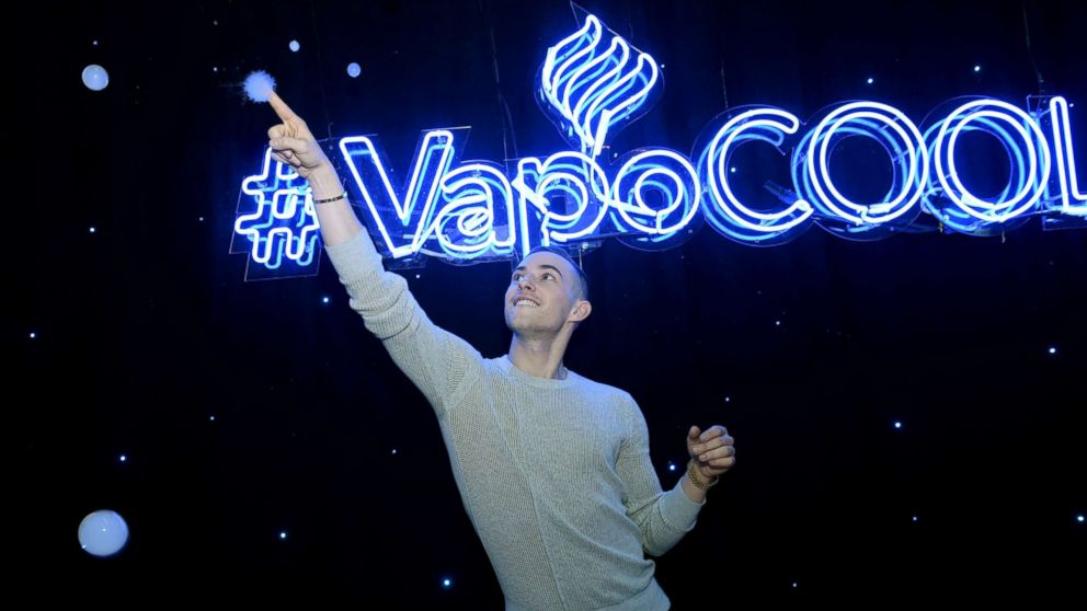 PHOTO: Adam Rippon poses at the NyQuil and DayQuil VapoCool experience in New York City on December 13, 2018.