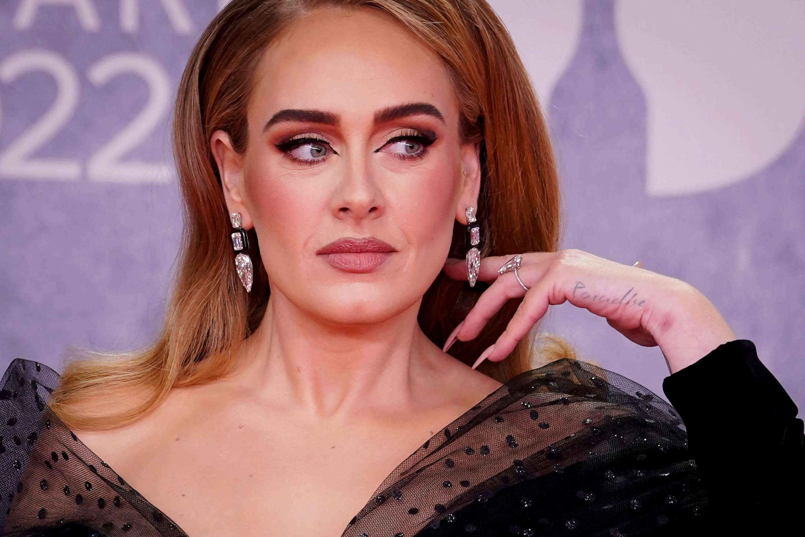 PHOTO: FILE - In this file photo taken on February 8, 2022, British singer Adele poses on the red carpet upon her arrival for the BRIT Awards 2022 in London.