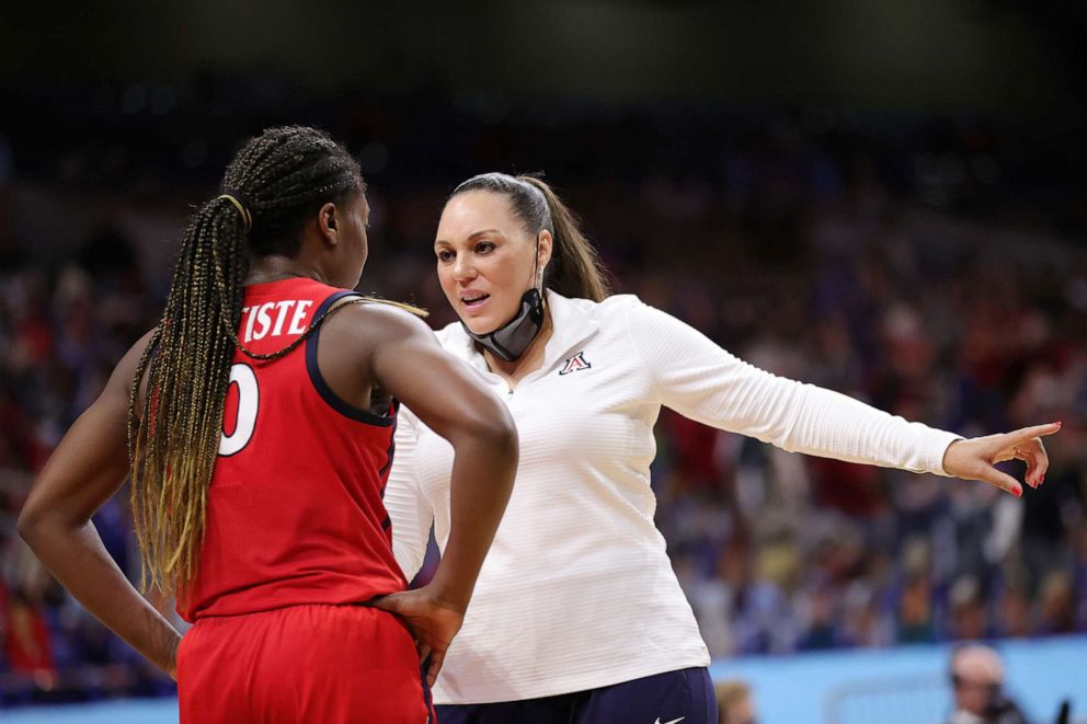 PHOTO: Head coach Adia Barnes of the Arizona Wildcats talks with Trinity Baptiste in the National Championship game of the 2021 NCAA Women's Basketball Tournament against the Stanford Cardinals at the Alamodome on April 04, 2021, in San Antonio, Texas.