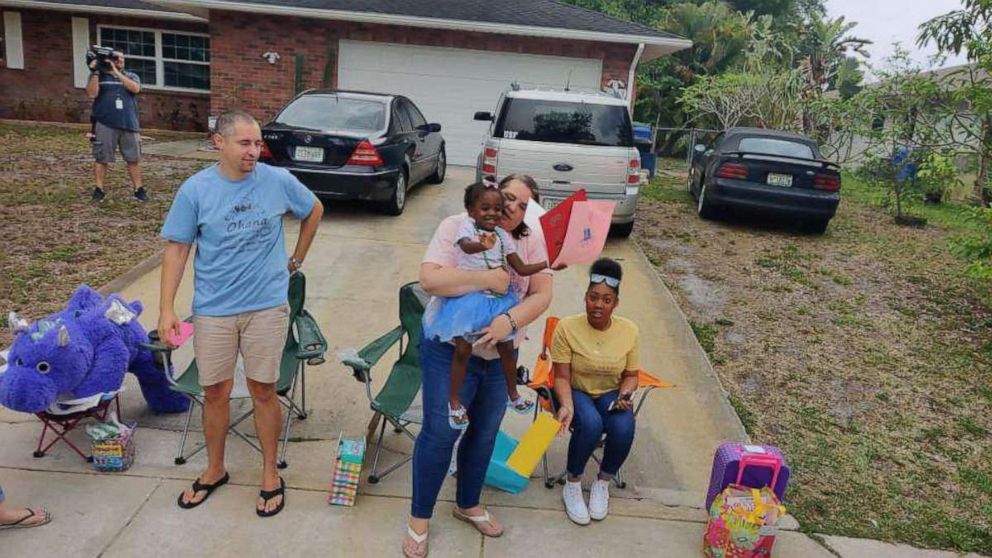 PHOTO: Cars lined the streets April 18 in Bradenton, Florida, for 3-year-old Reney just days after her parents Lynndsey and Jameson Wilson signed adoption papers. The family had to cancel Reney's original adoption party because of COVID-19.