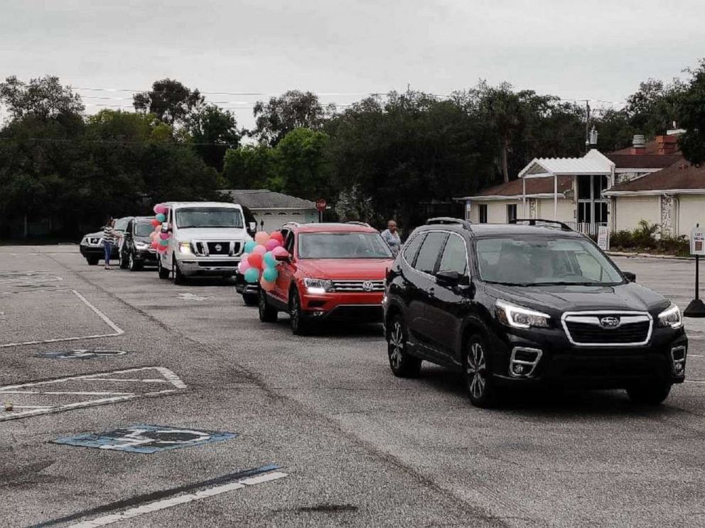 PHOTO: Cars lined the streets April 18 in Bradenton, Florida, for 3-year-old Reney just days after her parents Lynndsey and Jameson Wilson signed adoption papers. The family had to cancel Reney's original adoption party because of COVID-19.