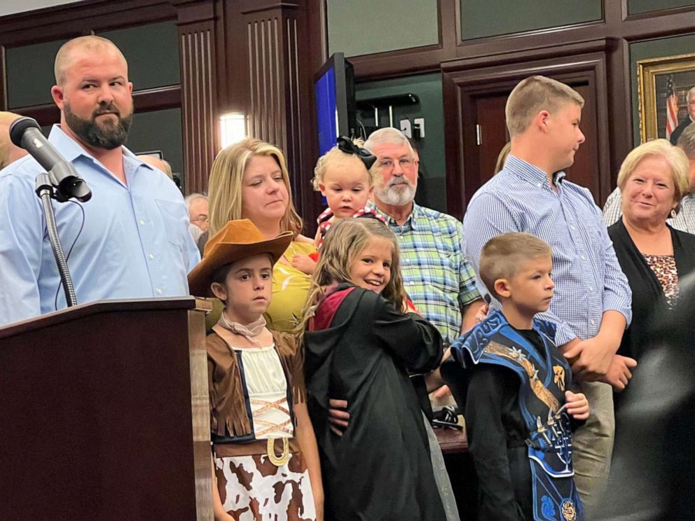 PHOTO: Families and children stand for the adoption ceremony at the courthouse in Duval County, Fla., on Oct. 29, 2021.