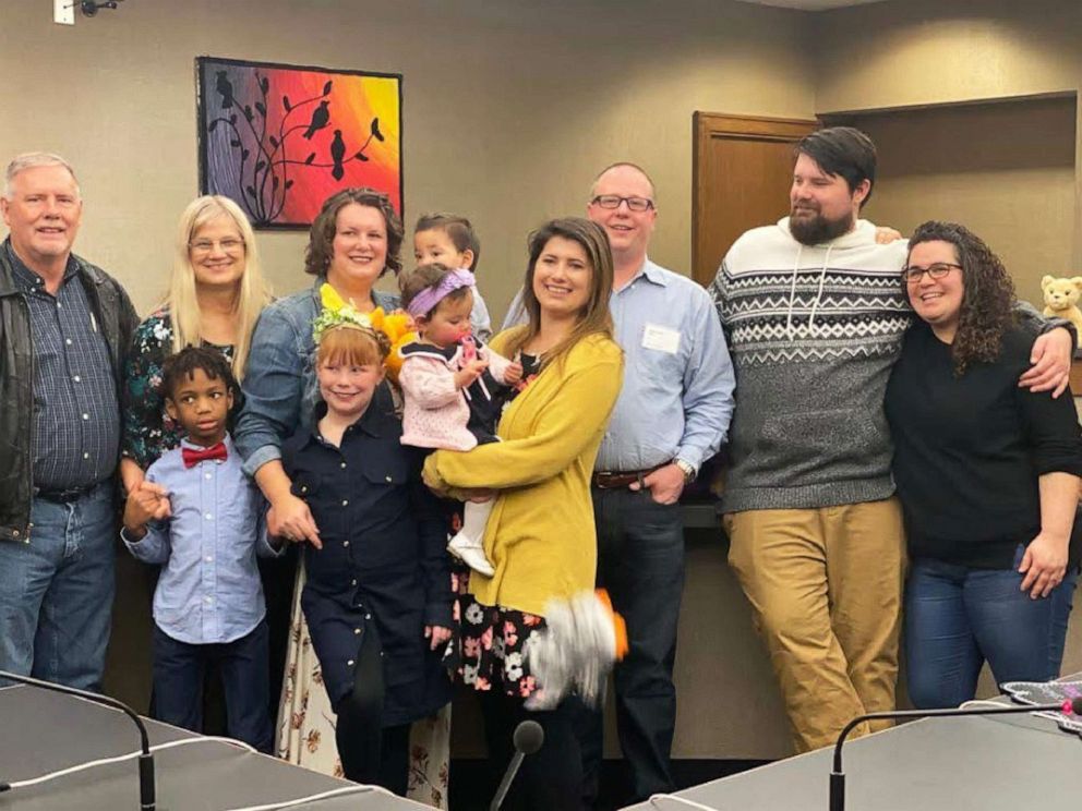 PHOTO:  Jenny and Cullen Hall pose in a Minnesota courtroom with their four kids and family members on Nov. 23, 2019.