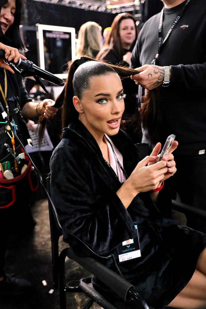 PHOTO: Adriana Lima prepares backstage during the Victoria's Secret Fashion Show 2024 at Duggal Greenhouse on Oct. 15, 2024, in Brooklyn, New York. 