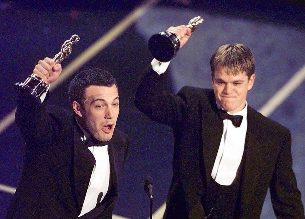 PHOTO: Ben Affleck and Matt Damon hold up their Oscars after winning in the Original Screenplay  Category during the 70th Academy Awards at the Shrine Auditorium in Los Angeles, March 23, 1998.