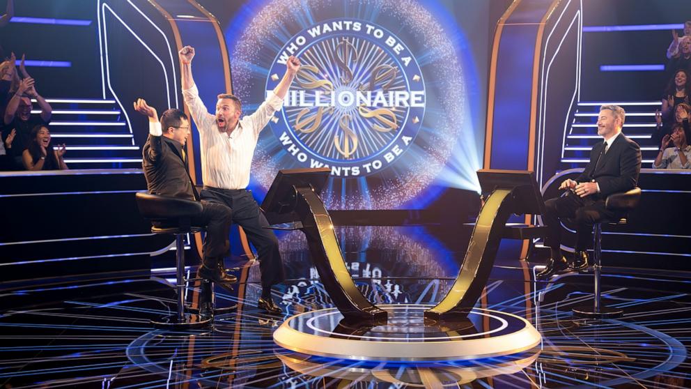 PHOTO: Jamie Ding and Ben Affleck celebrate winning a million dollars on "Who Wants To Be a Millionaire."