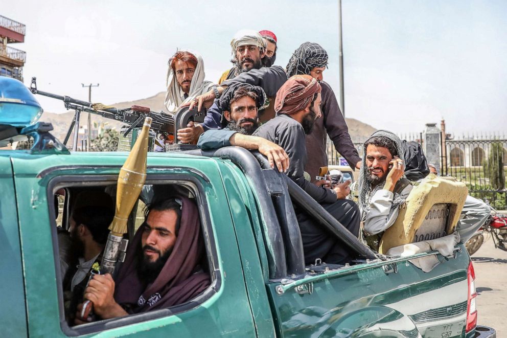 PHOTO: Taliban fighters are seen on the back of a vehicle in Kabul, Afghanistan, Aug. 16, 2021. Taliban co-founder Abdul Ghani Baradar declared victory and an end to the decades-long war in Afghanistan. 