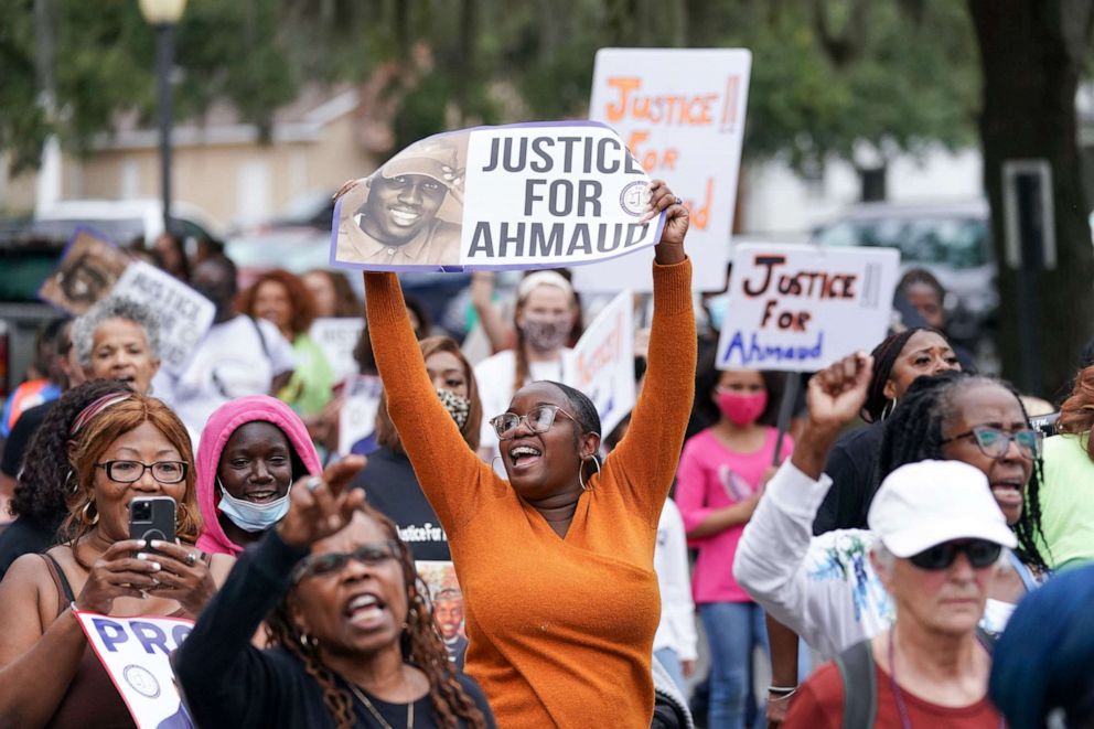 PHOTO: In this Nov. 18, 2021, file photo, demonstrators march near the Glynn County Courthouse after the adjournment of daily court proceedings in the trial for the killers of Ahmaud Arbery in Brunswick, Ga.