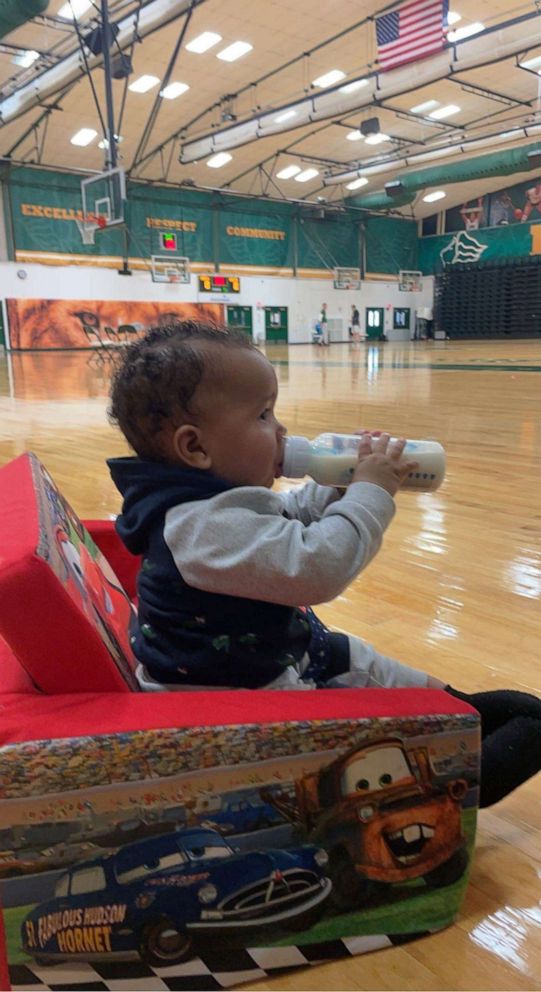 PHOTO: Aiden Webster, the son of Saint Leo University assistant basketball coach Ashley Webster, is pictured alongside the university's men's basketball team.