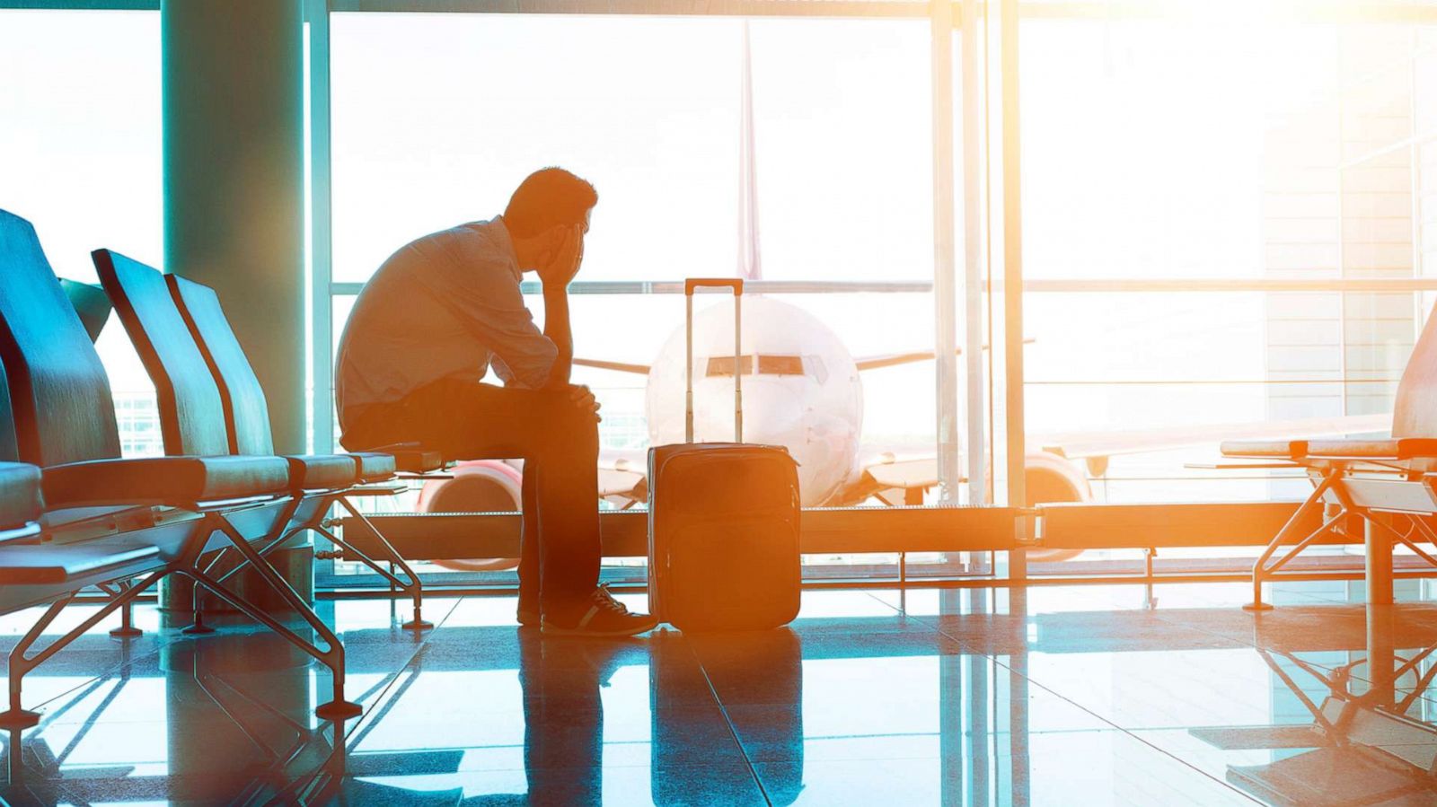 PHOTO: A man waits at an airport terminal.