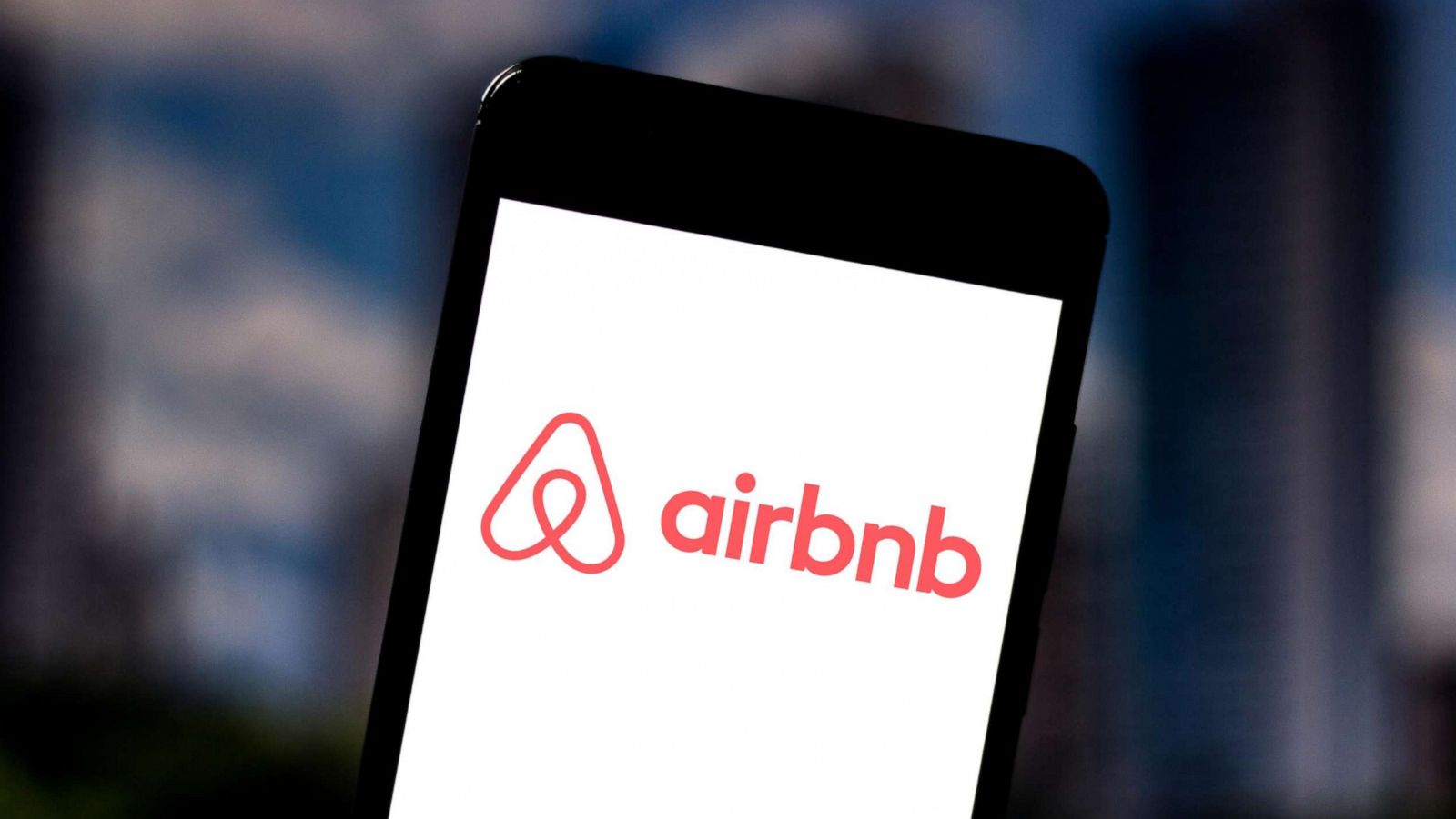 PHOTO: An Airbnb logo is seen displayed on a smartphone.