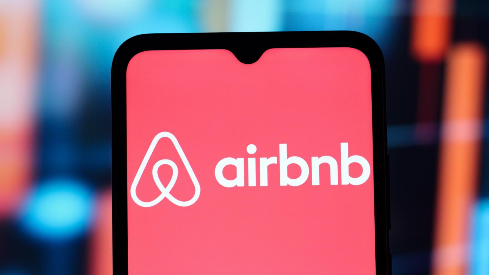 PHOTO: The Airbnb logo is seen displayed on a smartphone screen in a photo illustration.
