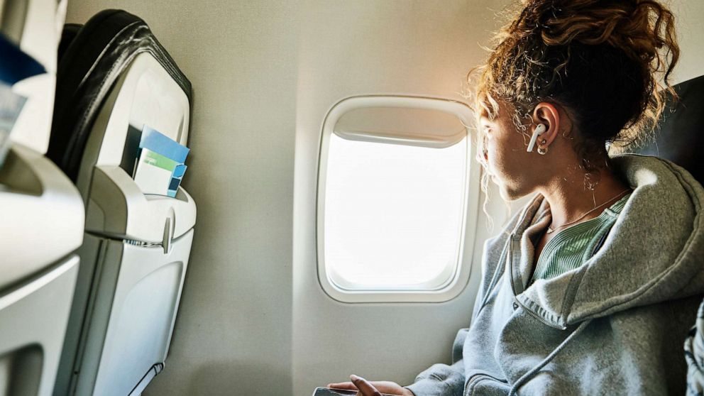 VIDEO: Plane passenger and toddler battle over window shade in viral video