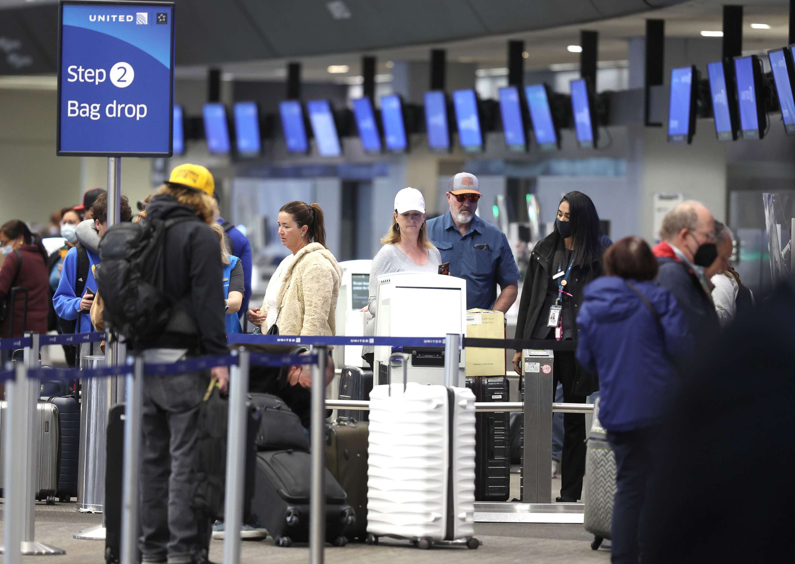 PHOTO: Passengers check in for flights at San Francisco International Airport, April 19, 2022, in San Francisco.