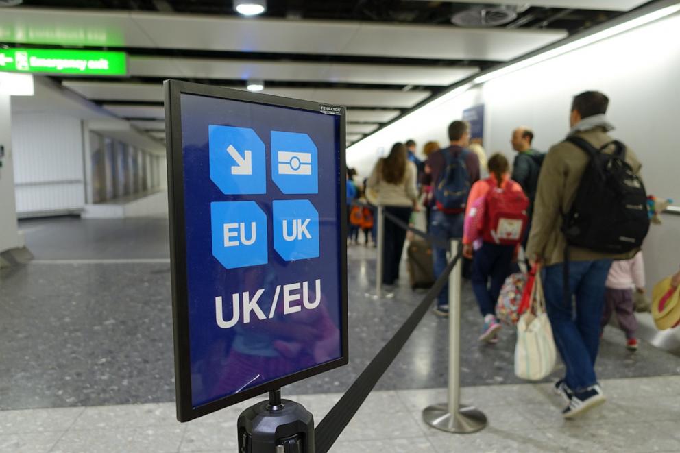 PHOTO: View of a UK/EU lane sign as air travelers proceed to Passport Control at a British Airport.