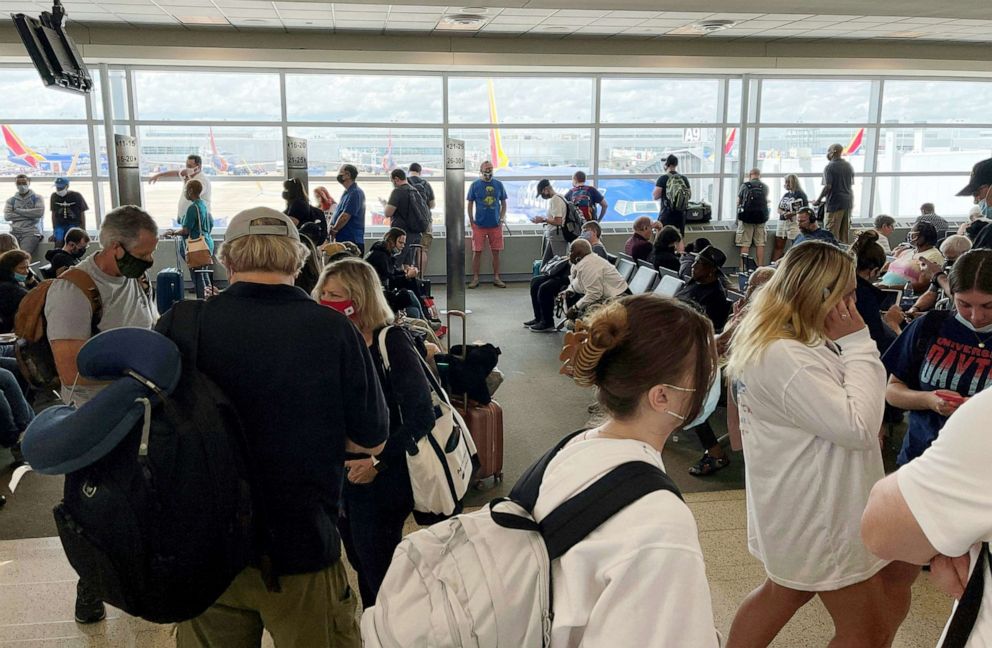 PHOTO: Passengers travel inside a terminal at Midway Chicago airport in Chicago, June 29, 2021.