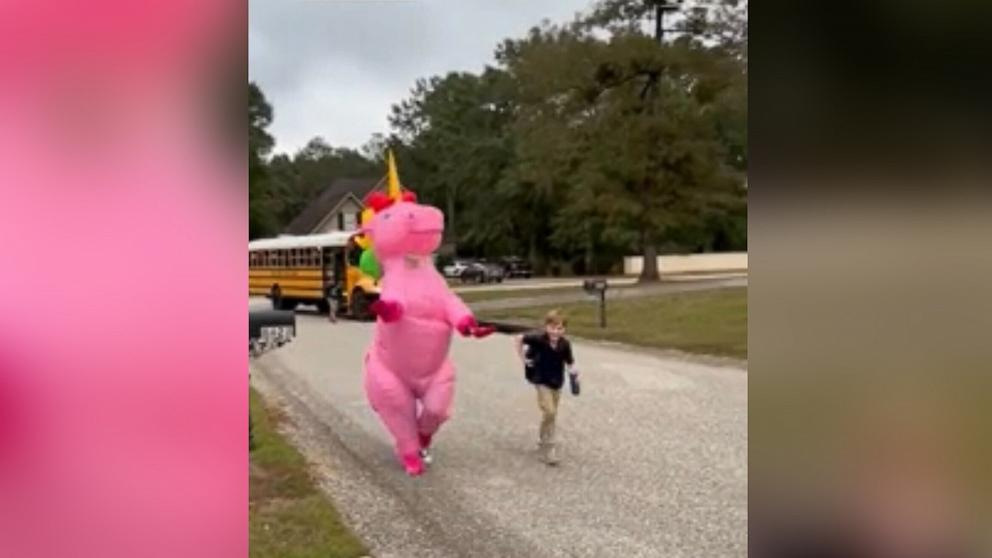 PHOTO: Alabama mom's best friend surprised her 9-year-old son dressing as a Unicorn at a bus stop.