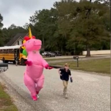 PHOTO: Alabama mom's best friend surprised her 9-year-old son dressing as a Unicorn at a bus stop.