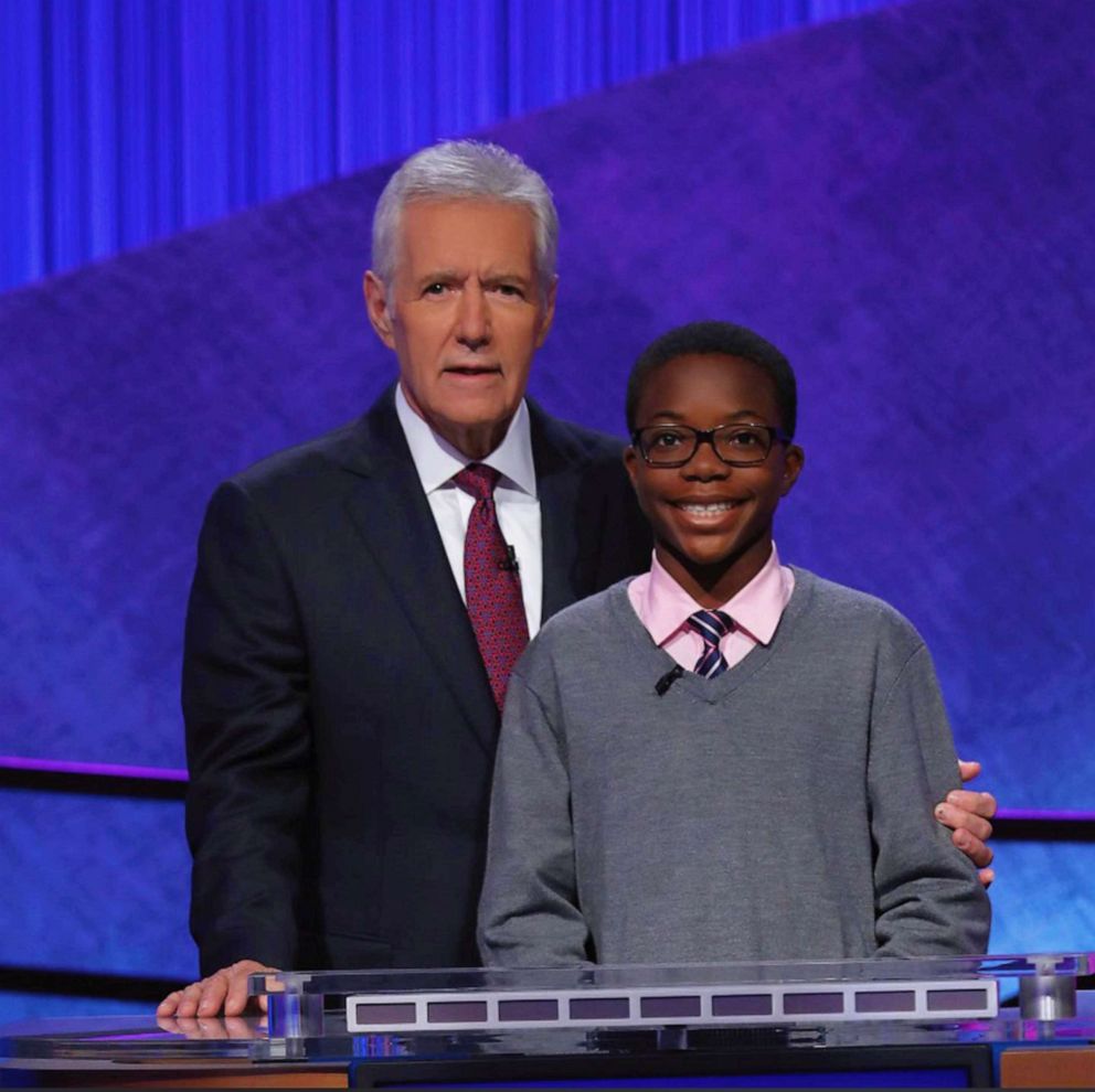PHOTO: Rotimi Kukoyi, a high school senior from Hoover, Ala., poses with Alex Trebek on the set of Jeopardy! game show.