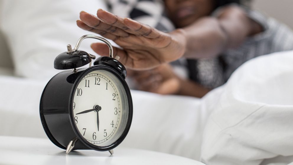 PHOTO: A women reaches for an alarm clock in this undated stock photo.