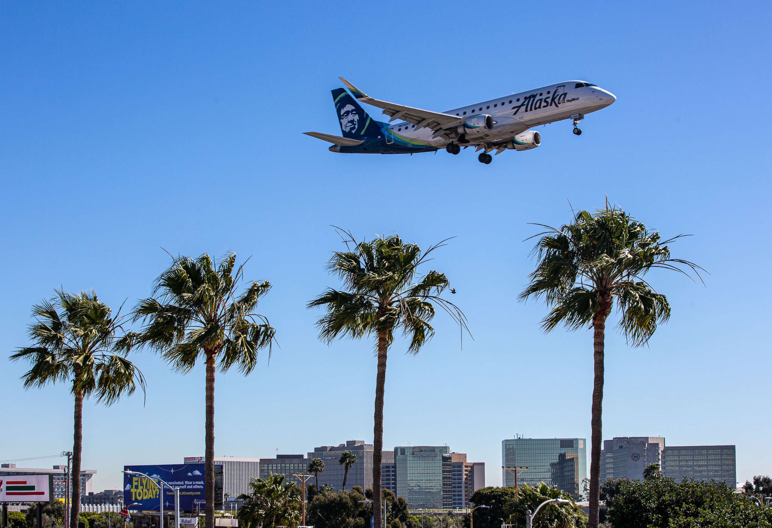 PHOTO: An Alaska airline plane flies near the Los Angeles International Airport on Feb. 7, 2022 in Los Angeles.