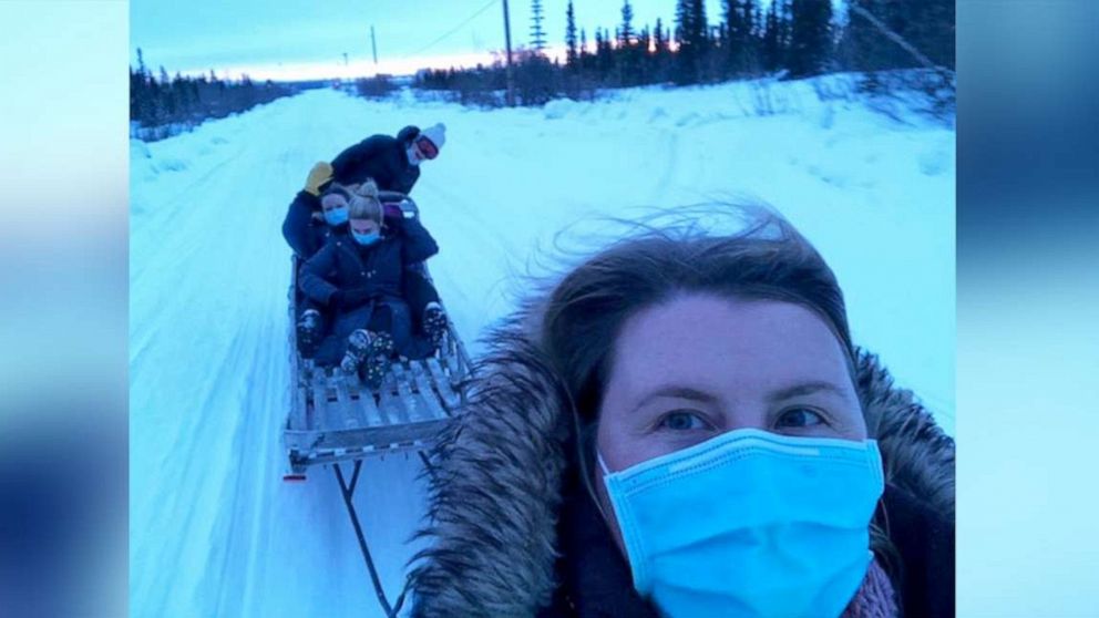 PHOTO: Dr. Katrine Bengaard and three fellow female healthcare workers deliver COVID-19 vaccines to people in rural Alaska.