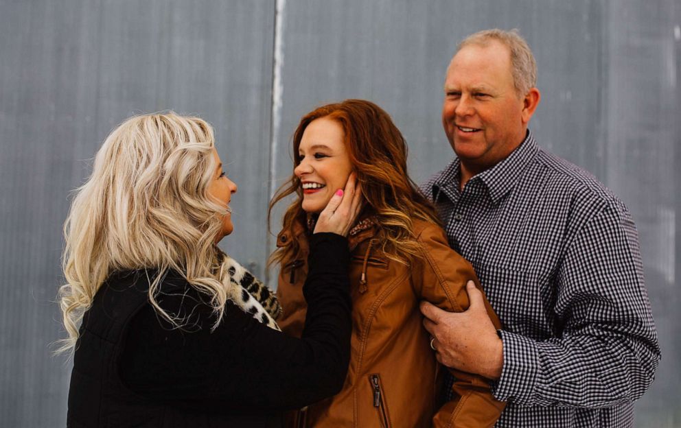 PHOTO: Jaci Hermstad, 25, is pictured with her parents, Lori and Jeff, in Webb, Iowa, March 2019.