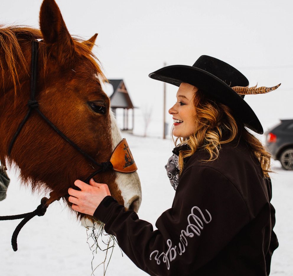 PHOTO: Jaci Hermstad is pictured with her horse, Bud, March 2019, in Webb, Iowa.