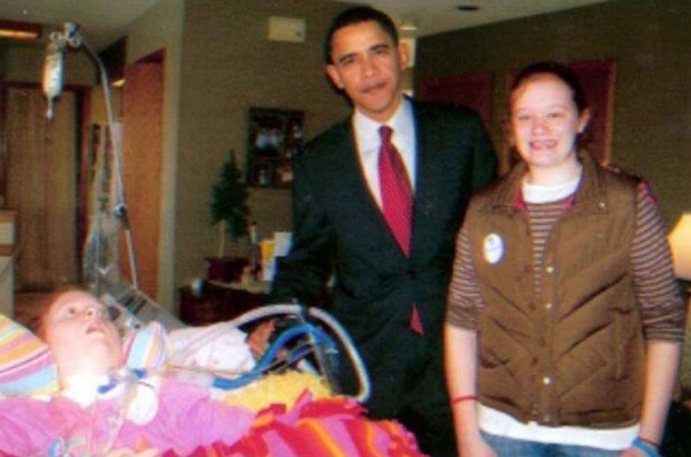 PHOTO: Then-presidential candidate Barack Obama poses for a photo with Alex, left, and Jaci Hermstad during a surprise visit to the family home in Storm Lake, Iowa in 2008.