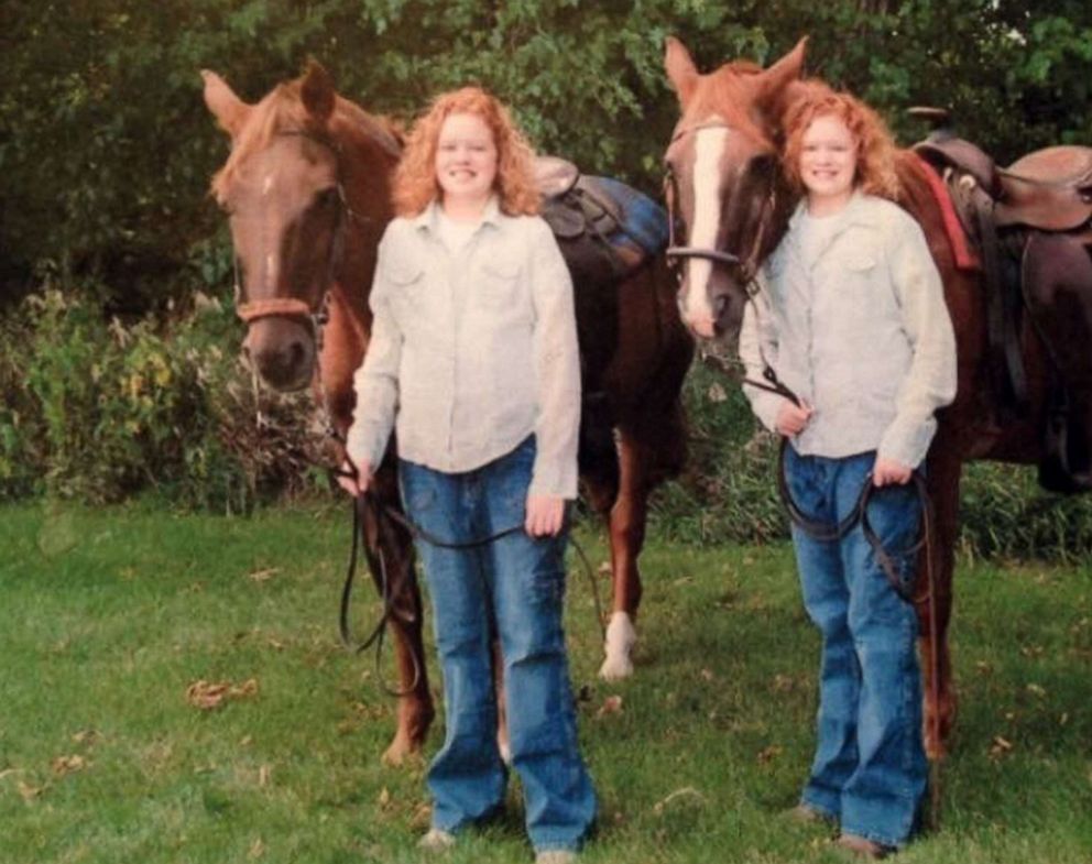 PHOTO: Alex and Jaci pose for a photo with their horses in Alta, Iowa in 2005.