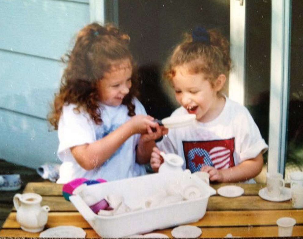 PHOTO: Alex and Jaci Hermstad play with their tea set on their deck at home in Storm Lake, Iowa, in 1997.