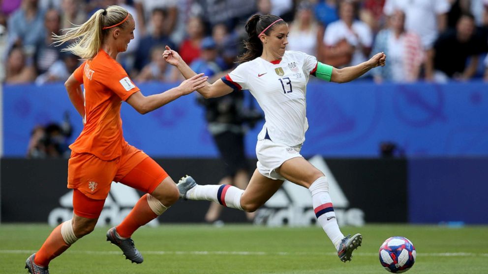 PHOTO: Alex Morgan, right, fights for the ball with Netherlands' Stefanie Van Der Gragt during the Women's World Cup final soccer match between US and The Netherlands at the Stade de Lyon in Decines, outside Lyon, France, July 7, 2019.