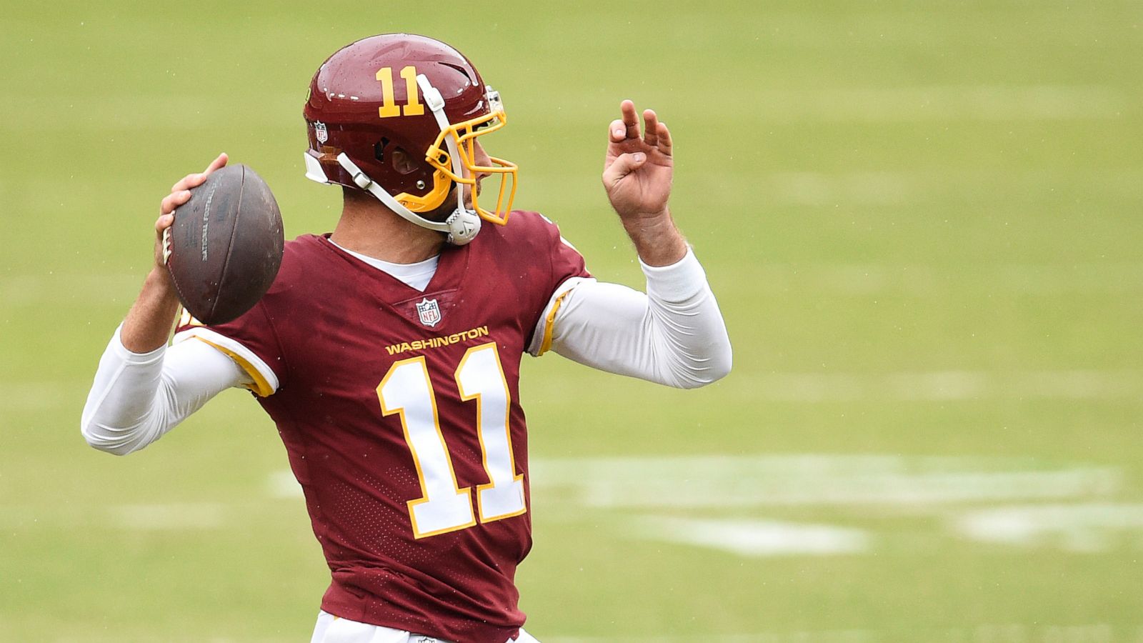 PHOTO: Alex Smith of the Washington Football Team throws a pass in the second quarter against the Los Angeles Rams at FedExField on Oct. 11, 2020 in Landover, Md.